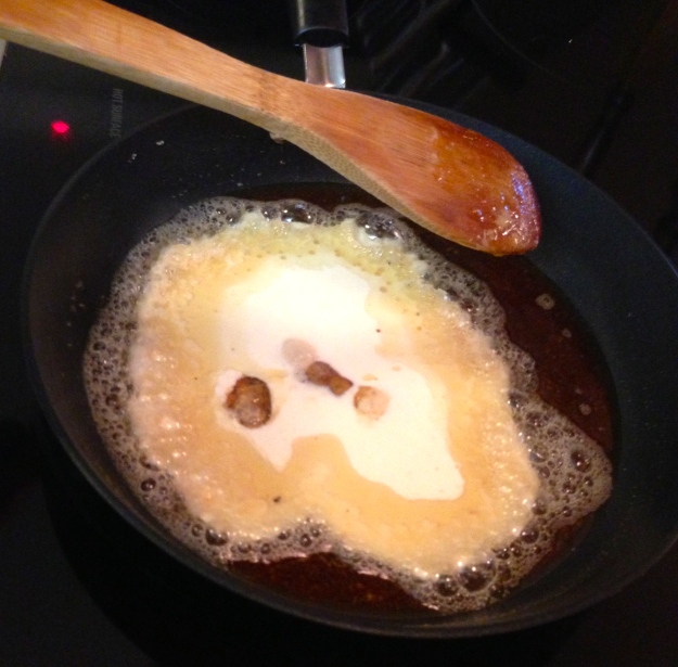 stirring the cream into the caramel